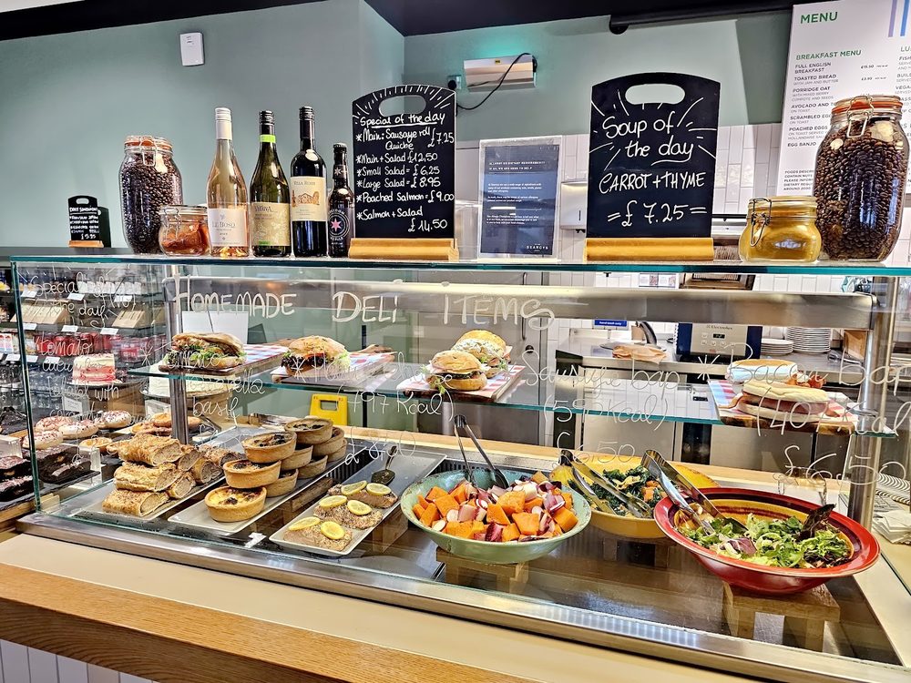 The deli counter filled with sandwiches, salads and bowls